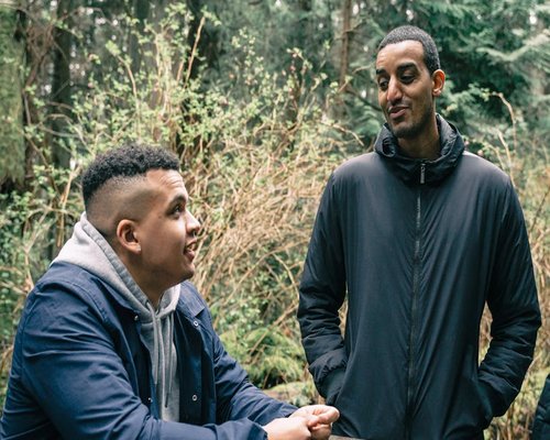 Group of friends walking and talking outdoors